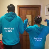 The Wander Crew in branded hoodies